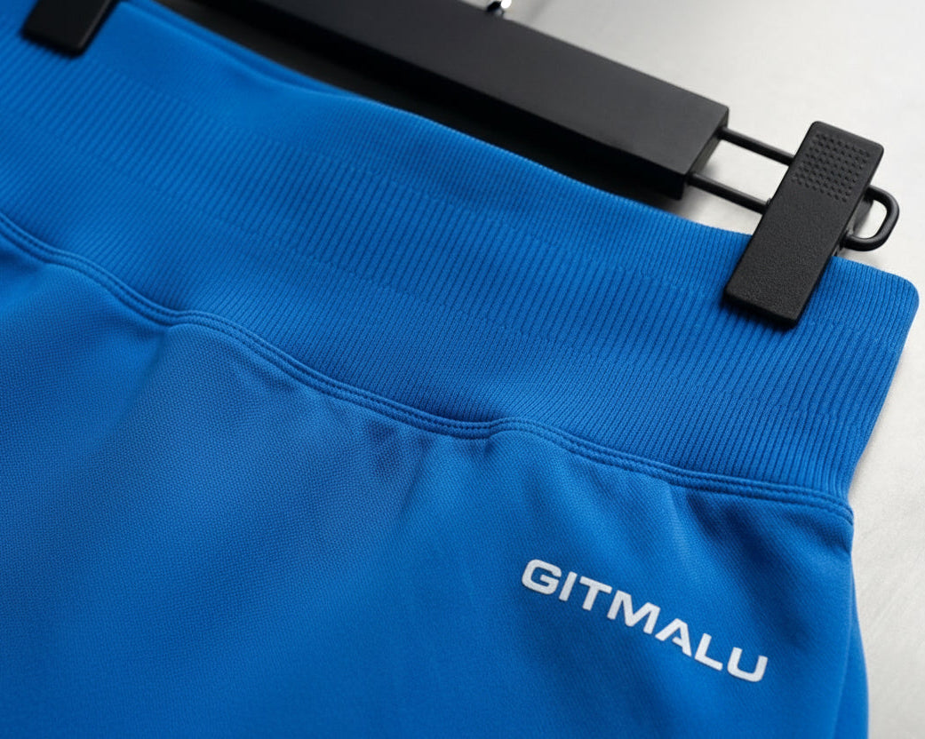 Blue sweatshirt with 'GITMALU' logo on a gray background